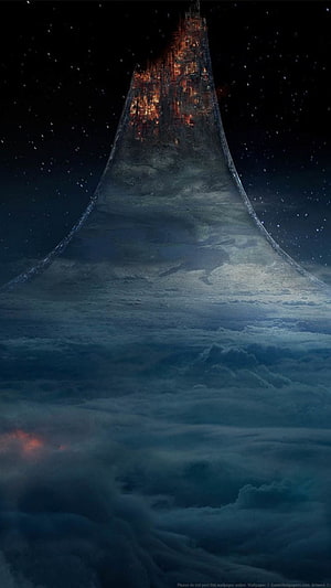 Majestic Tower Rising Above Clouds at Night with Glowing Windows and Starry Sky HD phone wallpaper