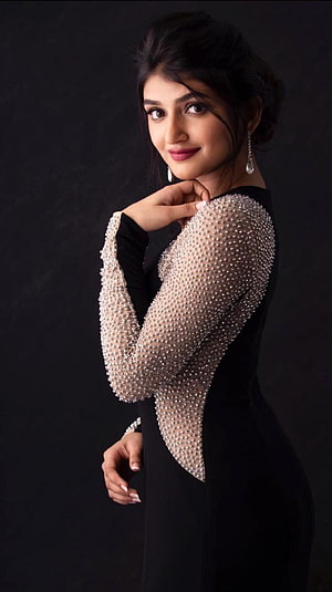Sreeleela in an elegant black gown with crystal-embellished sheer sleeves HD phone wallpaper