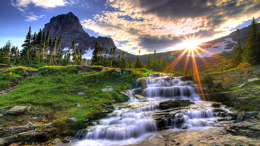 Majestic Mountain Waterfall Cascading Through Lush Green Valley at Sunset HD wallpaper