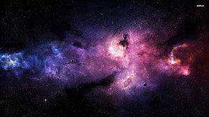 Vibrant Purple and Blue Nebula Clouds in Deep Space with Scattered Stars HD wallpaper