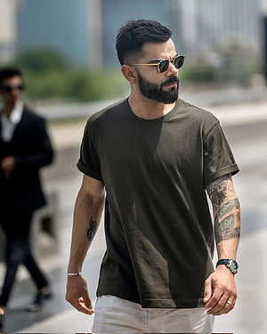 Virat Kohli in Olive T-Shirt and Sunglasses Walking in an Urban Setting HD phone wallpaper