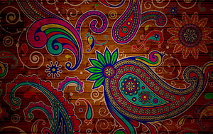 Vibrant Multicolored Paisley and Floral Motifs on Rustic Wood Grain Background HD wallpaper