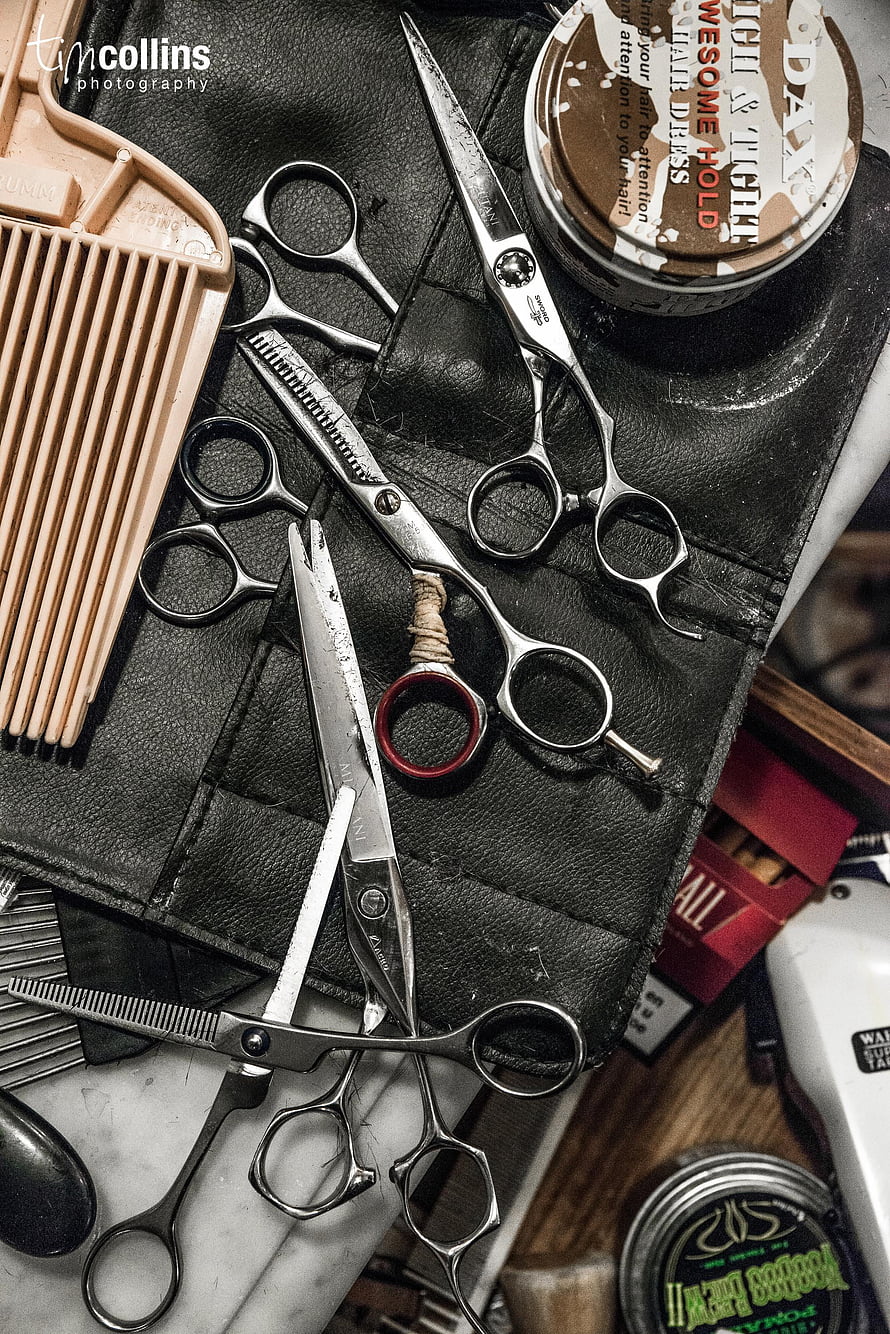 Vintage Barber Tools and Scissors on Black Leather Mat HD phone wallpaper