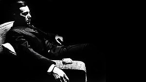Michael Corleone in a dramatic black and white portrait from The Godfather film series HD wallpaper