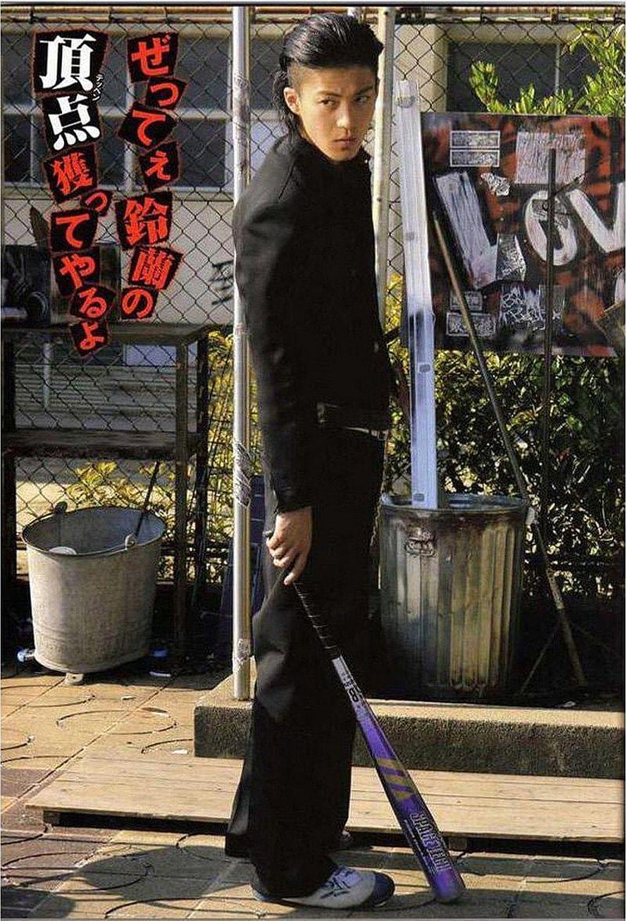 Takiya Genji in Black Suit Holding Baseball Bat in Urban Setting HD phone wallpaper