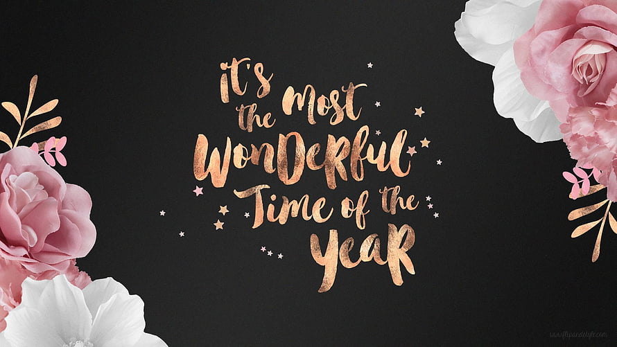 Festive Holiday Quote with Rose Gold Lettering and Pink Floral Accents on Black Background HD wallpaper