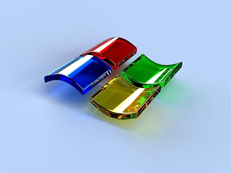 Four glossy 3D Windows logo panels in red, blue, green, and yellow on a light blue background HD wallpaper