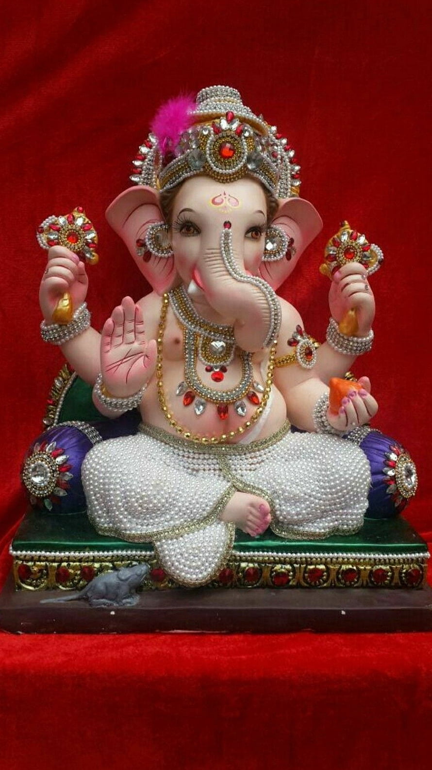 Ornate Ganesha Murti with Jeweled Crown and Pearl Drape on Red Velvet HD phone wallpaper