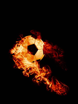 Blazing Soccer Ball Enveloped in Fiery Flames Against a Pitch Black Background HD phone wallpaper