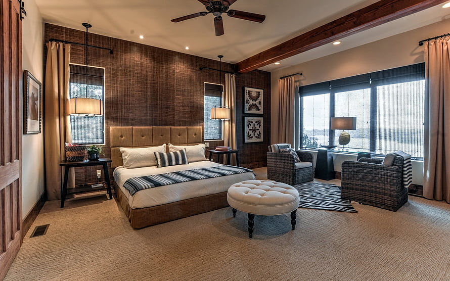 Rustic Master Bedroom With Exposed Beams, Tufted Headboard, and Woven Accent Chairs HD wallpaper