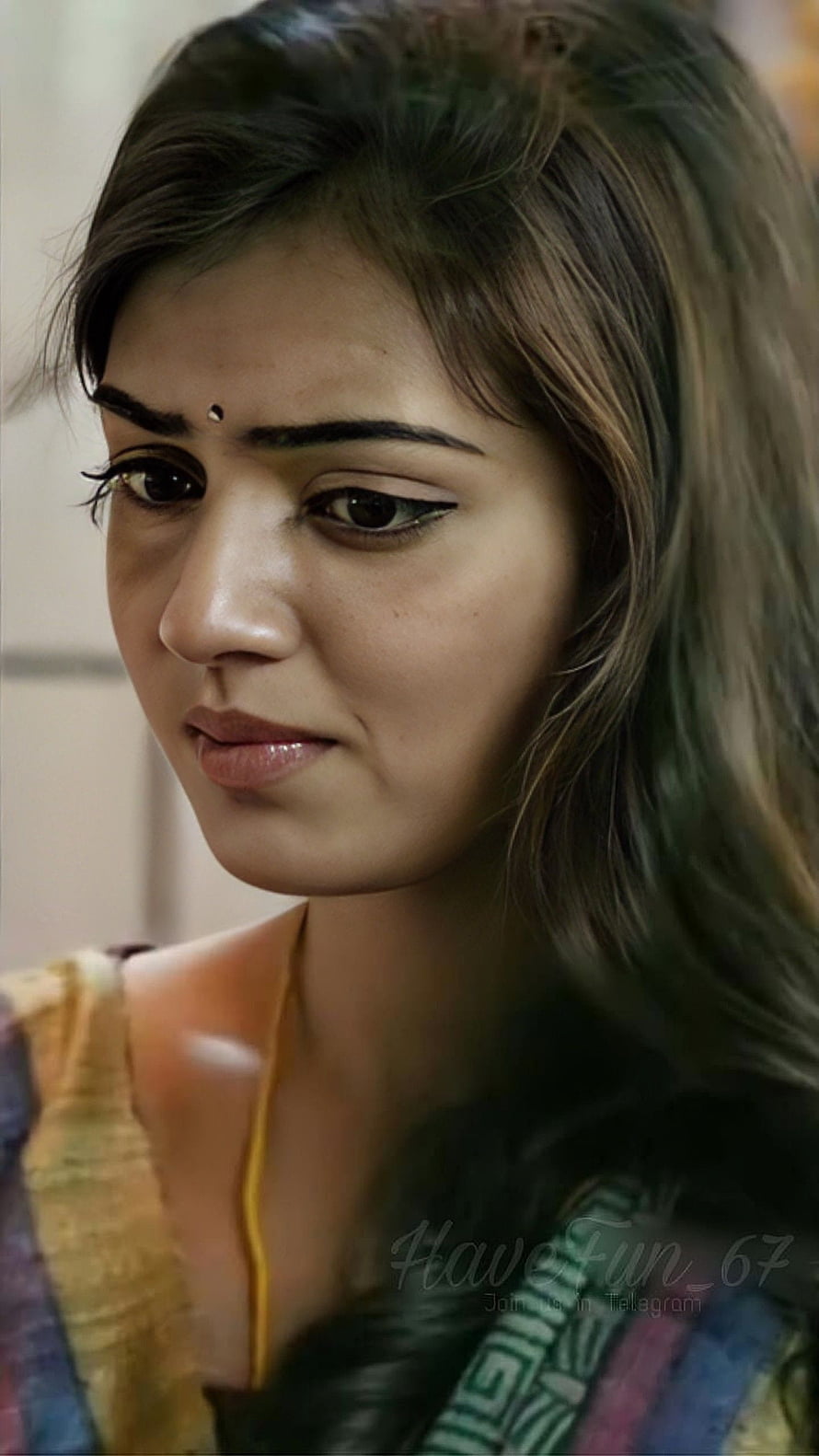 Nazriya Nizam in a colorful traditional outfit with a bindi and expressive gaze HD phone wallpaper