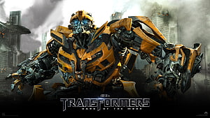 Bumblebee from Transformers Dark of the Moon in a battle-ready stance amidst a smoky cityscape HD wallpaper