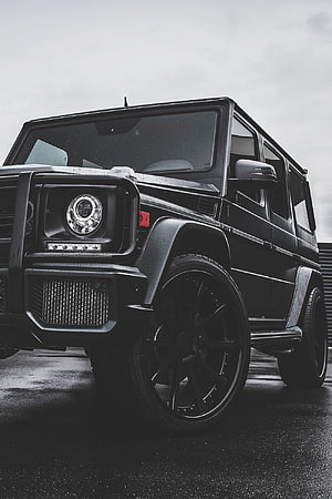Black Mercedes-AMG G63 G-Class SUV Front Quarter View on Wet Asphalt HD phone wallpaper