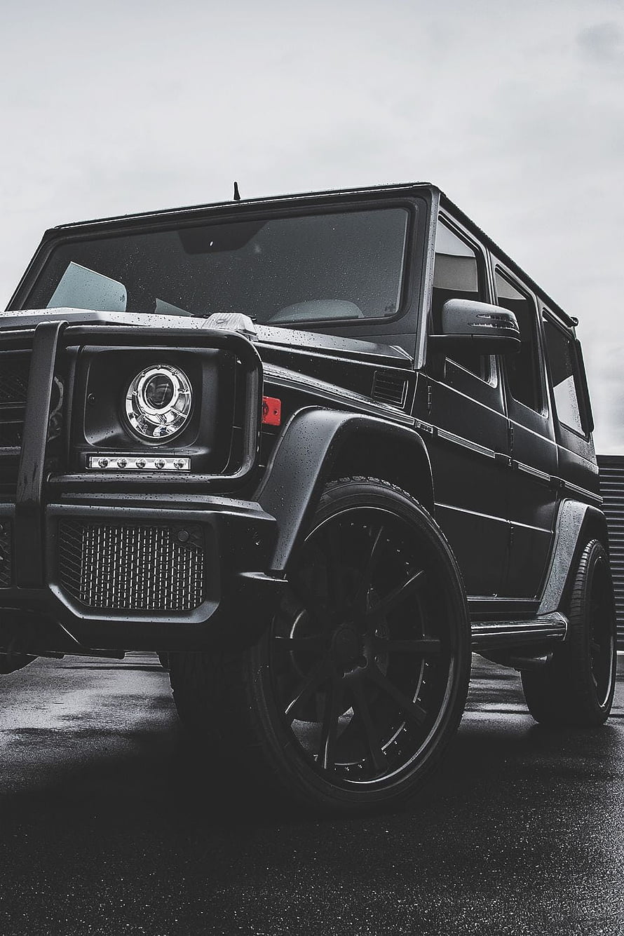 Black Mercedes-AMG G63 G-Class SUV Front Quarter View on Wet Asphalt HD phone wallpaper