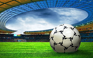 Soccer Ball on Green Pitch Inside a Large Stadium with Star Pattern Design HD wallpaper