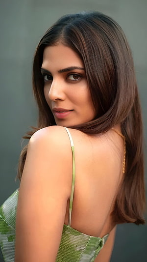 Malavika Mohanan Portrait in Green Dress with Long Brown Hair HD phone wallpaper