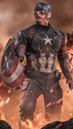 Captain America in Battle Worn Armor Holding a Cracked Shield Amidst Fire and Debris HD phone wallpaper
