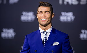 Cristiano Ronaldo in a Royal Blue Suit at a Formal Event HD wallpaper