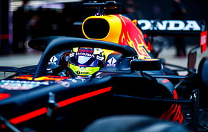 Sergio Perez in Red Bull Racing Honda Formula 1 Car on the Grid HD wallpaper
