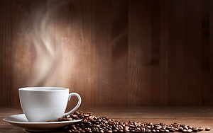 Steaming White Coffee Cup With Roasted Beans On Rustic Wooden Table HD wallpaper