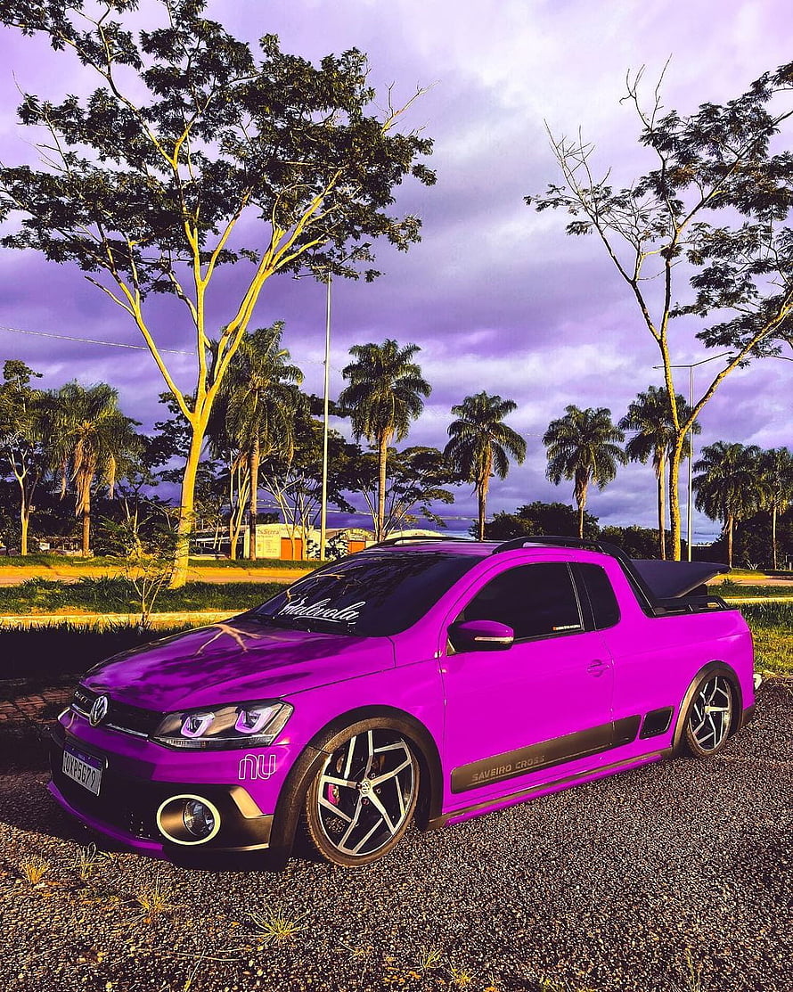 Vibrant Purple Volkswagen Saveiro Cross Pickup Parked on Gravel at Dusk HD phone wallpaper