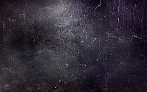 Dark Cracked Surface Texture with Scratches, Stains, and Weathered Distress HD wallpaper