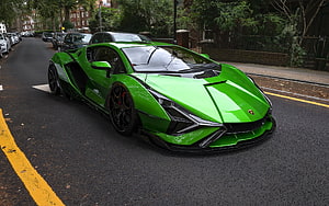 Vibrant Green Lamborghini Sian Super Car Parked on Urban Street HD wallpaper