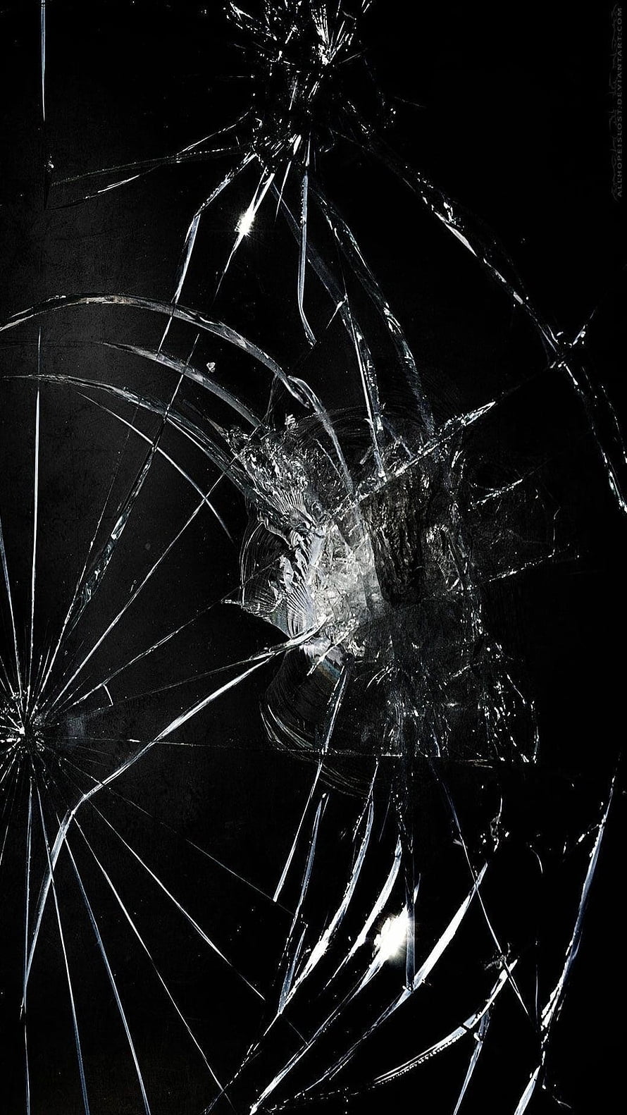 Shattered Glass Texture with Radiating Fracture Lines on Black Background HD phone wallpaper