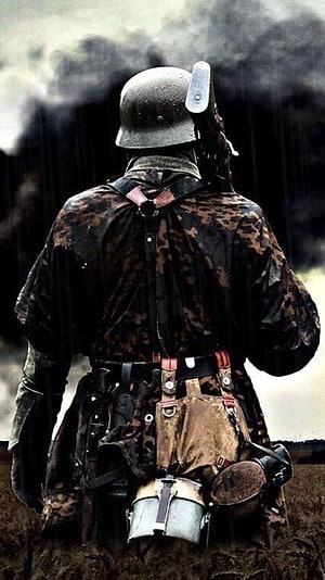 Waffen SS Soldier in Camouflage Standing in Trench with Smoke and Rain HD phone wallpaper