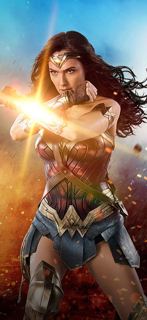 Wonder Woman in Golden Armor Blocking a Lasso Strike Amidst a Battlefield of Embers and Blue Sky, Wonder Woman XS, 10, X , , Background, . Wonder woman movie, Wonder woman , Wonder woman, Wonder Woman Android HD phone wallpaper