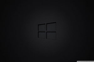 Dark Minimalist Windows Logo on Textured Black Surface HD wallpaper