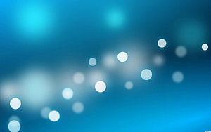 Abstract Blue Bokeh Background with Soft White Light Circles and Gradient Glow HD wallpaper
