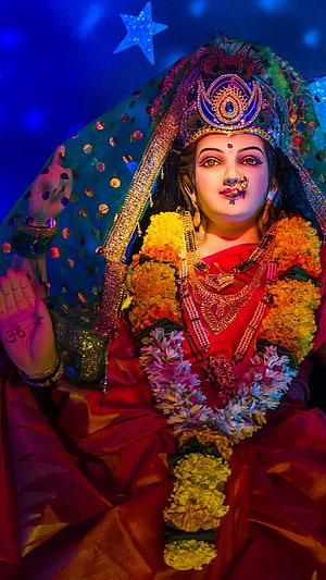 Ekveera Aai Durga Idol Adorned in Red Saree with Floral Garlands and Ornate Jewelry HD phone wallpaper