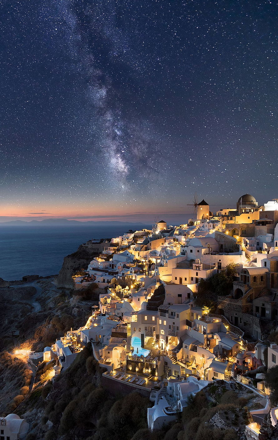 Milky Way Galaxy Arching Over the White Buildings of Oia, Santorini at Night HD phone wallpaper