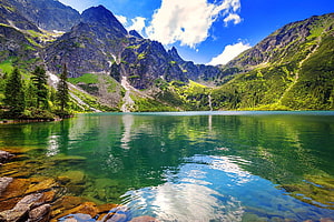 Tatra Mountains Alpine Lake with Crystal Clear Water and Mountain Reflections HD wallpaper