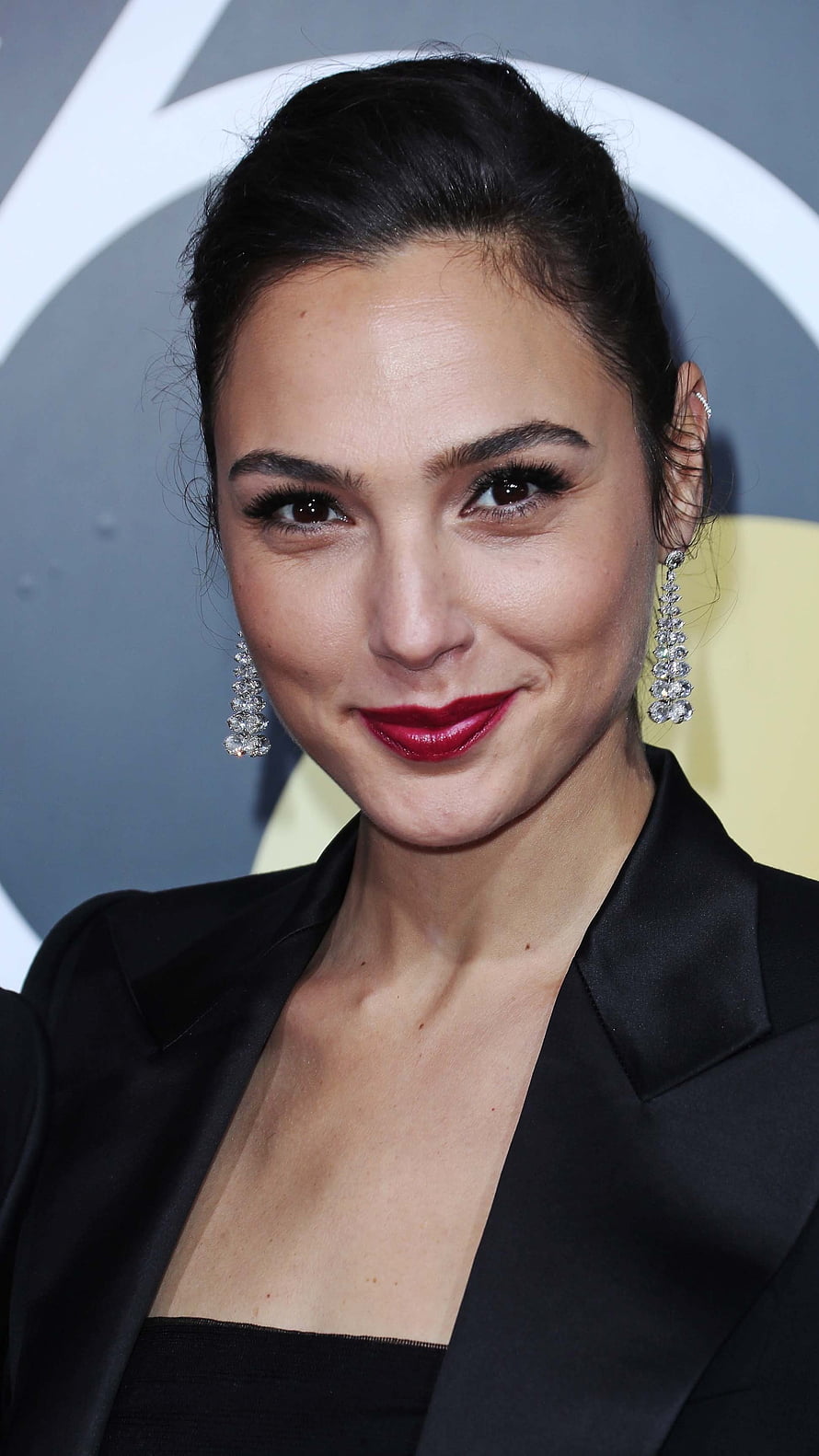 Gal Gadot in Black Blazer with Diamond Earrings and Red Lipstick at a Formal Event HD phone wallpaper