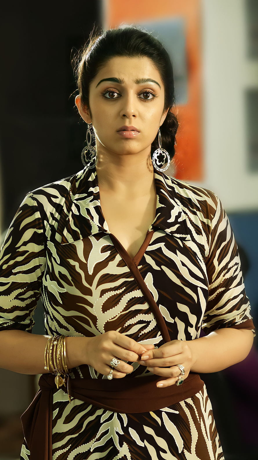 Charmi Kaur in a Brown and White Patterned Wrap Dress with Gold Jewelry HD phone wallpaper