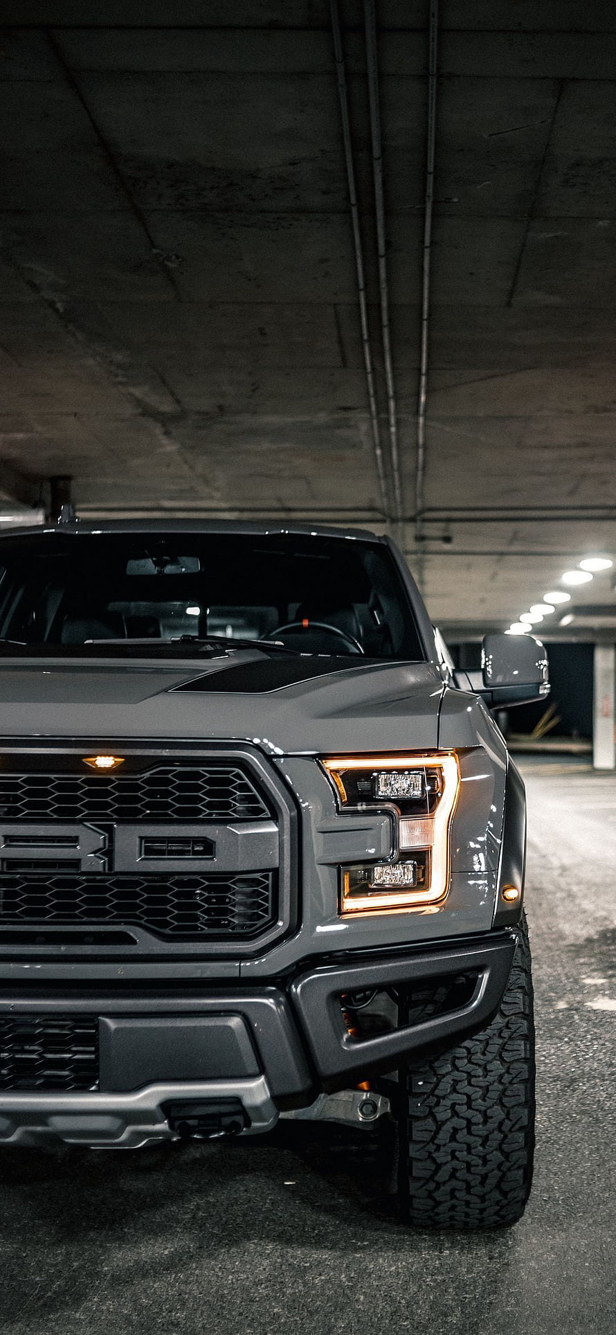 Gray Ford F-150 Raptor Front Grille and Headlights in Underground Parking Garage HD phone wallpaper