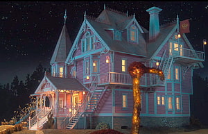 Coraline Movie Pink Victorian House at Night with Starry Sky and Glowing Windows HD wallpaper