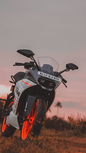 KTM RC 290 Sport Motorcycle with Orange Rims at Sunset HD phone wallpaper