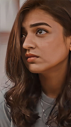 Nazriya Nizam Uddin Close-Up Portrait with Soft Lighting and Wavy Hair HD phone wallpaper