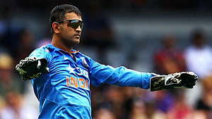 MS Dhoni in Indian Cricket Team Jersey Wearing Sunglasses and Gloves on the Field HD wallpaper