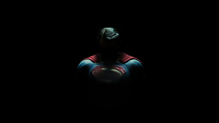 Superman in Shadow: Dark Cinematic Hero Portrait with Iconic Chest Emblem HD wallpaper