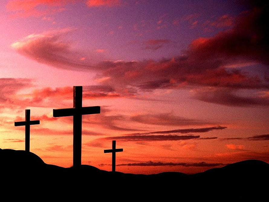 Three Silhouetted Crosses on a Hilltop Against a Dramatic Sunset Sky HD wallpaper