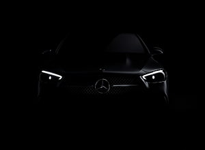 Mercedes-Benz Front Fascia with Illuminated Headlights in Dramatic Blackout Setting HD wallpaper