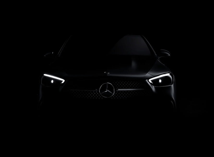 Mercedes-Benz Front Fascia with Illuminated Headlights in Dramatic Blackout Setting HD wallpaper