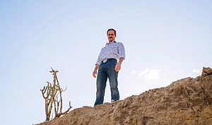 Better Call Saul Character Standing on Arid Hilltop Under Clear Sky HD wallpaper