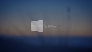 Windows 10 Default Boot Screen with Minimalist Logo on Blurred Ocean Horizon HD wallpaper