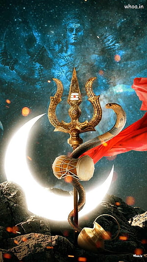 Lord Shiva Trishul and Crescent Moon with Snake and Damaru on Rocky Terrain HD phone wallpaper