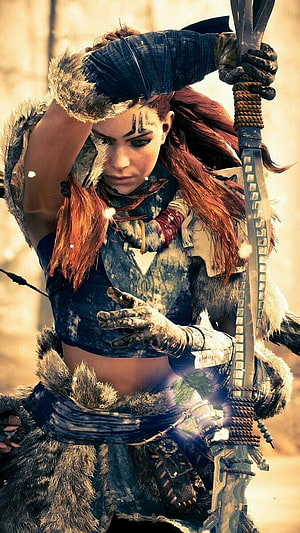 Aloy from Horizon Zero Dawn in tribal armor holding a bow in a desert landscape HD phone wallpaper